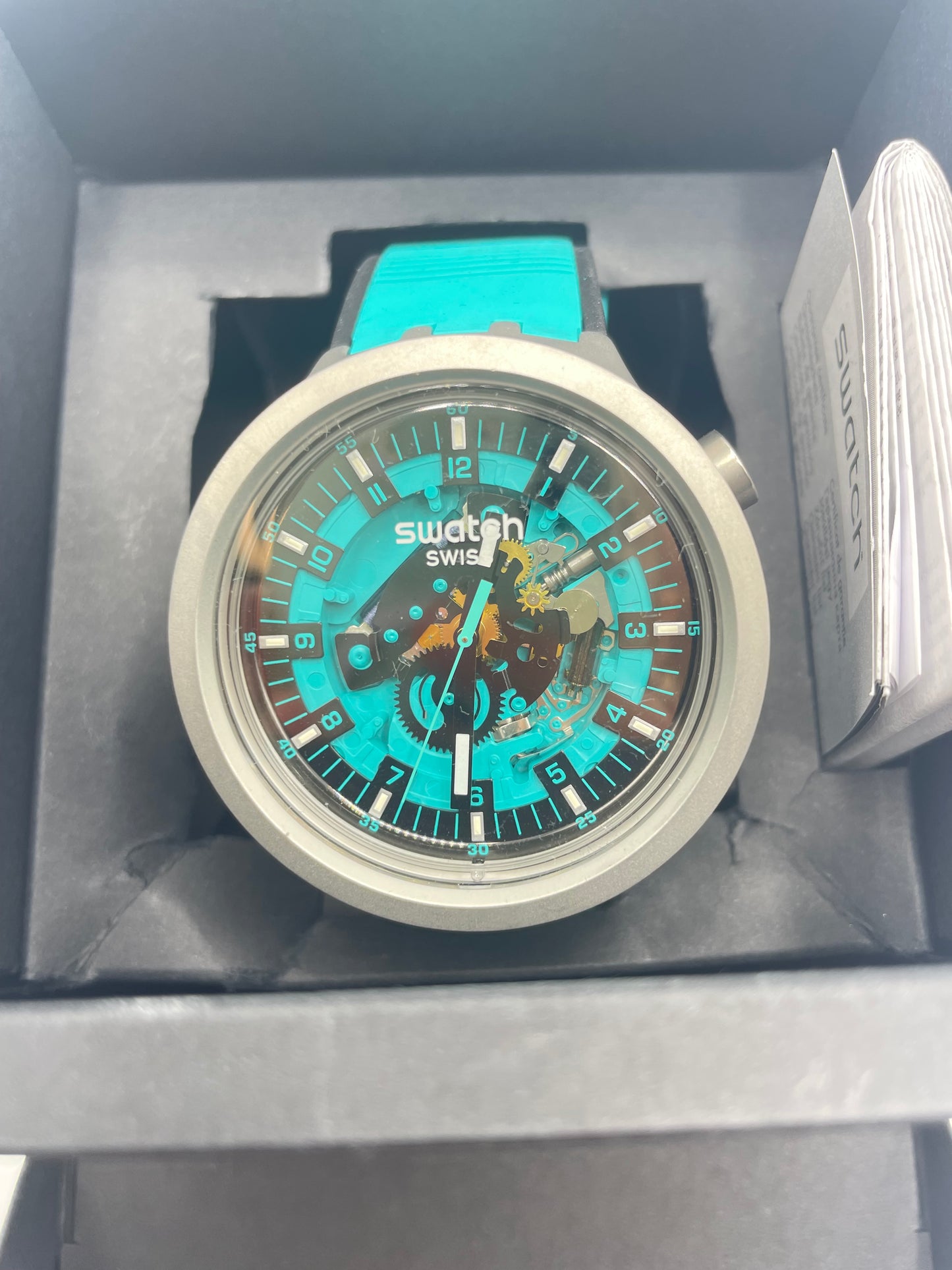 Montre Swatch turquoise noir